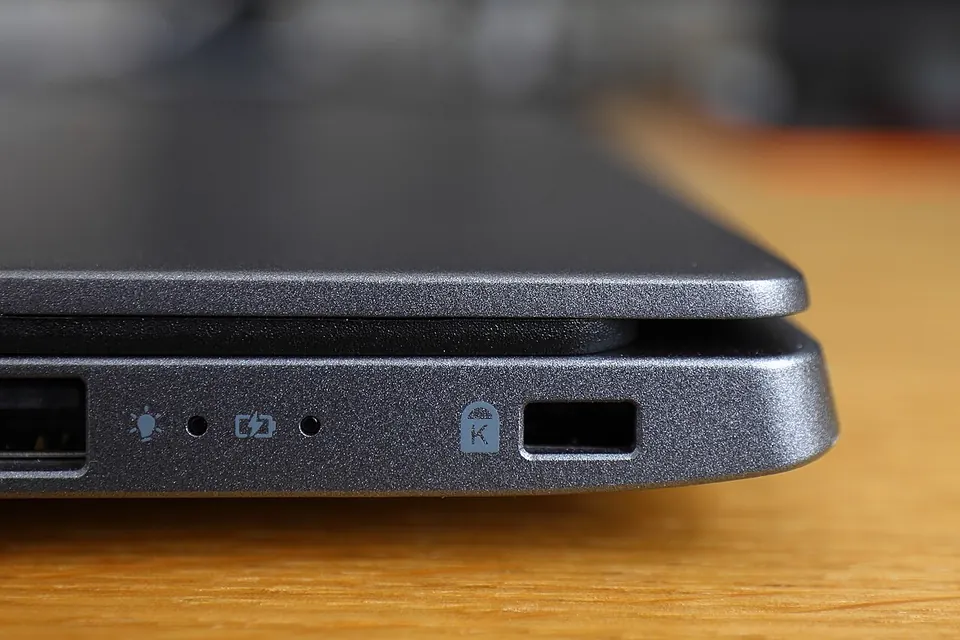 Close-up of the small rectangular security slot on the side of an Acer Swift 3 laptop